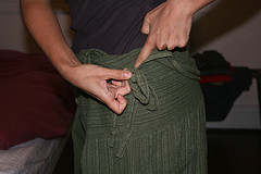 Step 13: According to preference, you may want to tuck under the cloth that covers the knot